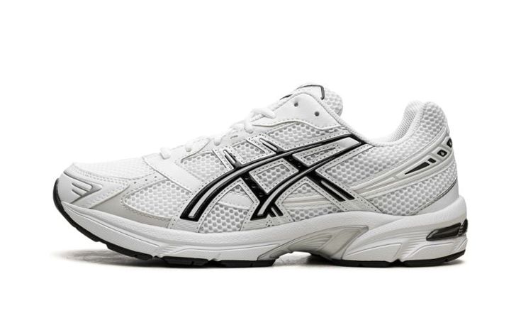 The ASICS Gel-1130 “Black/White” is another standout colorway of the retro performance running shoe.  The ASICS Gel-1130 was first released in 2008 and is now one of the most popular sneakers in the Y2K trend in sneaker culture.  On this colorway, the upper features a white mesh construction with tonal and light grey leather overlays.  ASICS’s classic tiger stripes are designed in white and accented in black  on either side of the shoe.  “ASICS” and “Gel-1130” branding are seen on the mesh tongu White Asics Skate Shoes For Streetwear, Black Lace-up Asics Sneakers, Black Lace-up Asics Running Shoes, Asics Ub2-s Gel-1130, Asics Black Lace-up Running Shoes, Nike X Travis Scott, Popular Sneakers, Kids Converse, Jordans Women