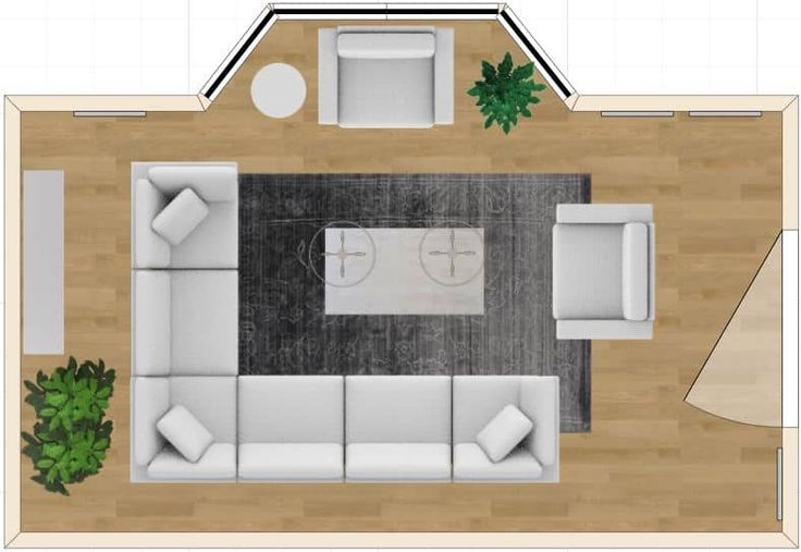 an overhead view of a living room and dining area with couches, coffee table, potted plant and other furniture