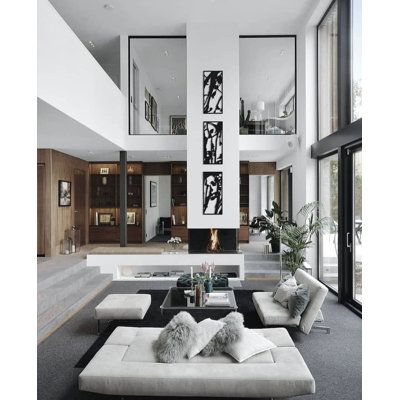 a living room filled with furniture and lots of windows