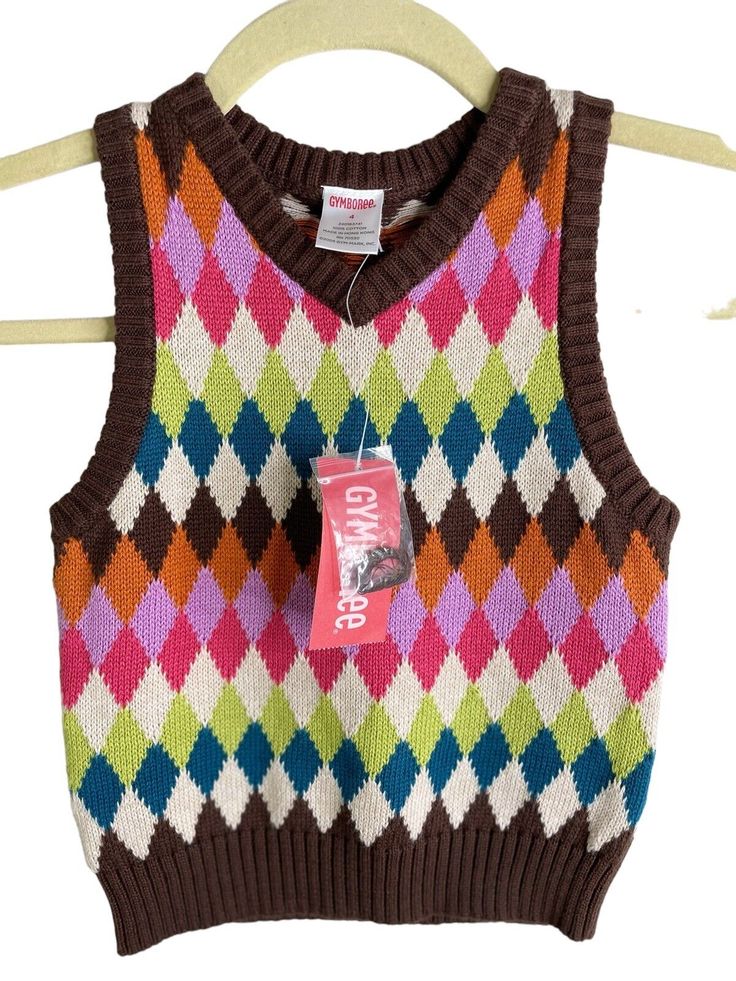 gymboree mix and match argyle sweater vest top NWT cotton sz 4. Pet friendly and smoke free home. Please contact me with any questions! Multicolor Cotton Sweater Vest For Winter, Casual Argyle Pattern Vest For Fall, Fitted Brown Cotton Sweater Vest, Brown Fitted Cotton Sweater Vest, Fitted Multicolor Sweater Vest For Winter, Fitted Multicolor Sweater Vest For Fall, Casual Multicolor Cotton Sweater Vest, Multicolor Cotton Winter Vest, Casual Cotton Sweater With Argyle Pattern