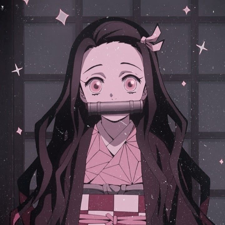 an anime character with long hair and pink shirt holding a box in front of her face