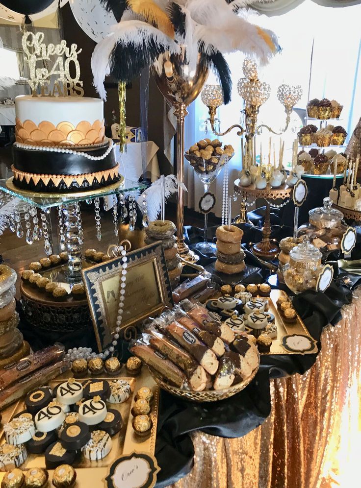 a table filled with lots of desserts and cakes