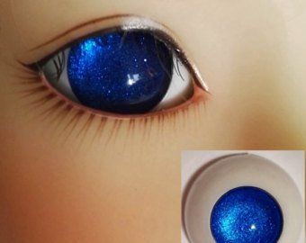 an eye with blue glitter on it