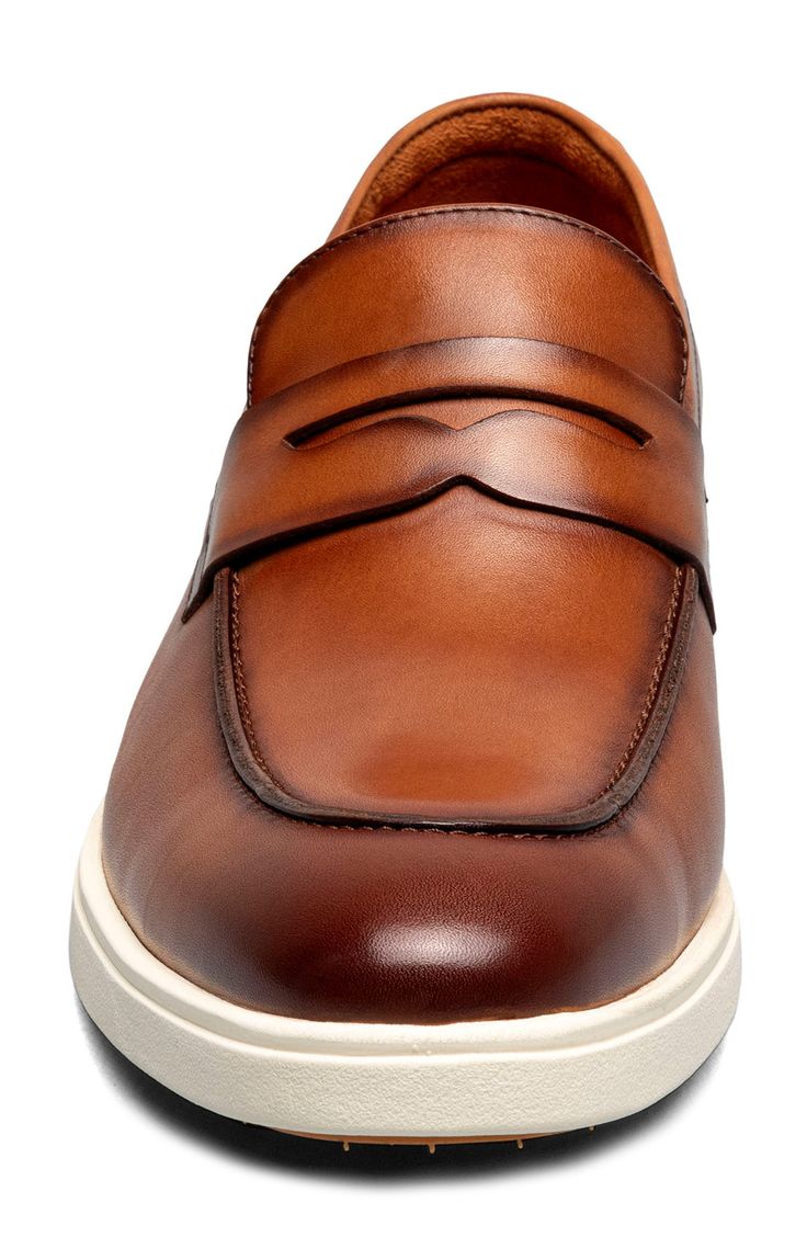 A classic penny keeper and moc toe add timeless elements to a burnished leather loafer grounded by a durable rubber sole. Removable, cushioned insole with arch support Leather and synthetic upper/textile lining/rubber sole Imported Classic Moc Toe Slip-ons With Cushioned Footbed, Classic Slip-ons With Cushioned Footbed And Moc Toe, Leather Wingtip Loafers With Cushioned Footbed, Classic Brown Slip-ons With Cushioned Footbed, Classic Brown Low-top Slip-ons, Classic Leather Shoes With Cushioned Moc Toe, Brown Wingtip Loafers With Cushioned Footbed, Classic Low-top Moccasins With Cushioned Footbed, Classic Brown Low-top Loafers