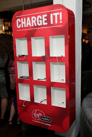 a red and white sign that says charge it