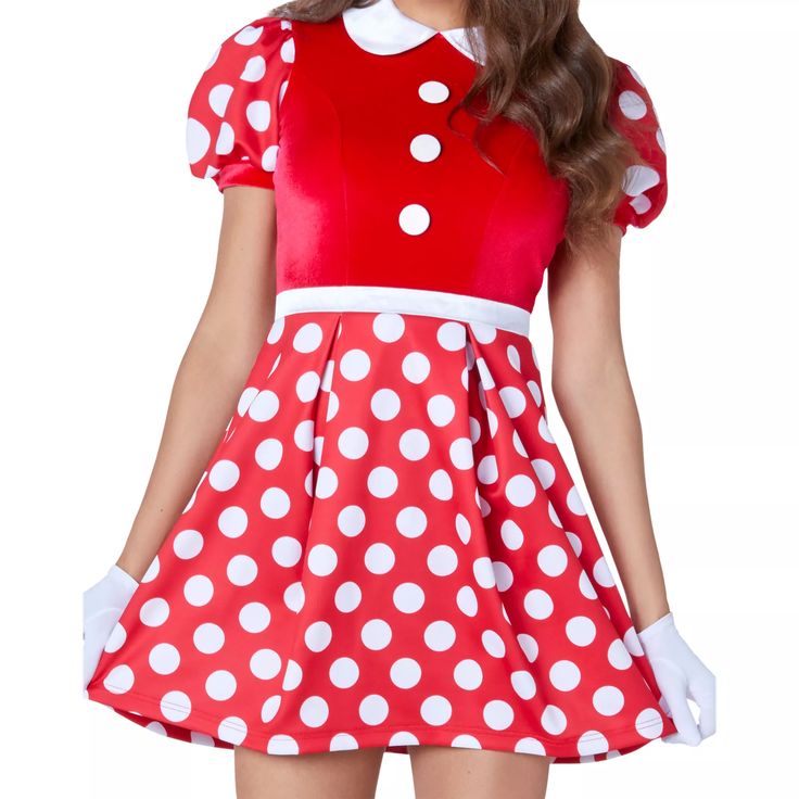 a woman wearing a red and white polka dot dress with large white dots on it