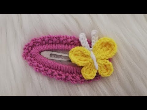 a crocheted hair clip with a yellow butterfly on it