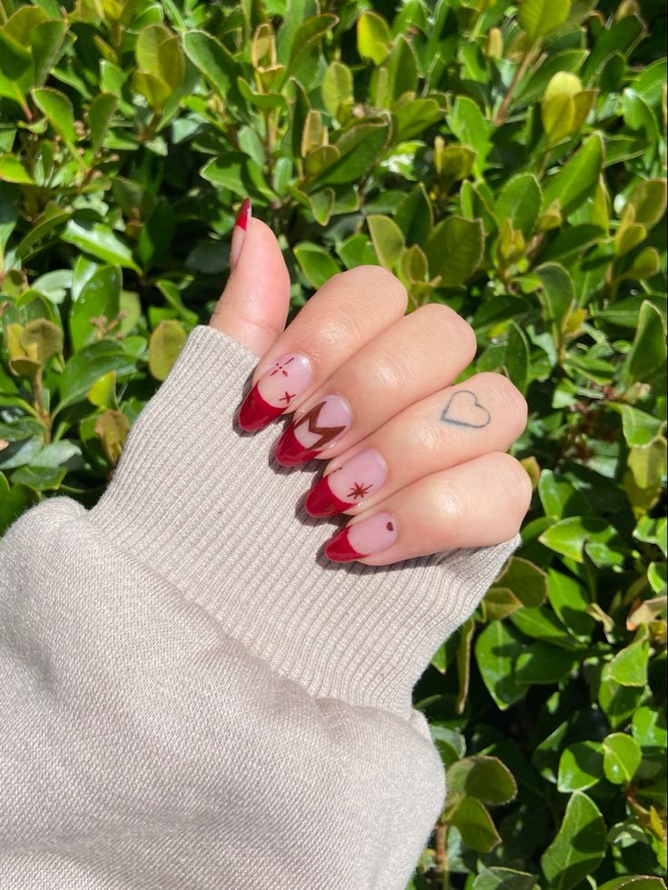 Scarlet witch/ Wanda Maximoff nails. Red French tip nails with stars and Wanda logo Wanda Inspired Nails, Wanda Maximoff Inspired Nails, Disney Marvel Nails, Scarlet Nails Design, Marvel Avengers Nails, Wanda Maximoff Nails Designs, Marvel Nails Short, Iron Man Nails Designs, Marvel Gel Nails