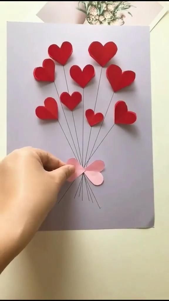 valentine's day card with paper hearts on it and the words follow for more