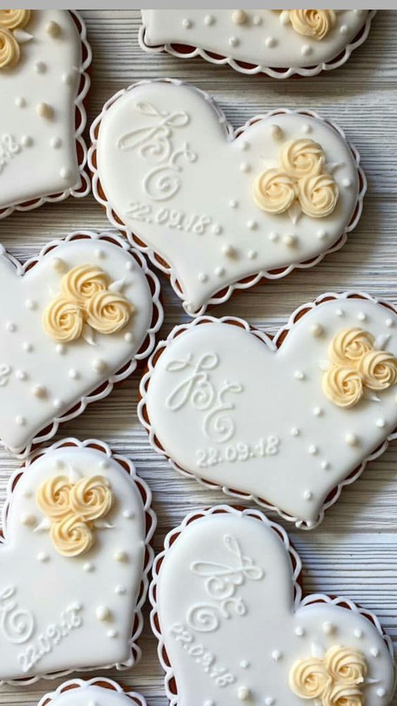 decorated cookies in the shape of hearts on a table