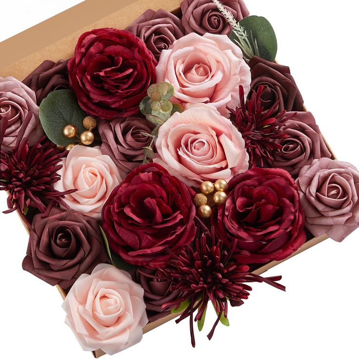 a bouquet of flowers in a box on a white background