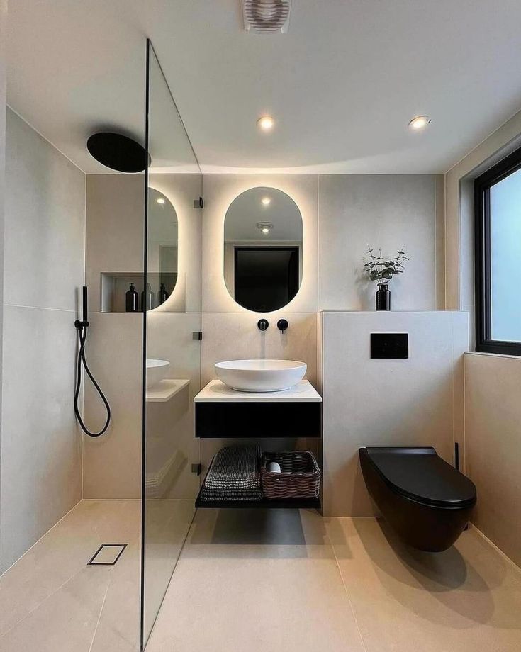 a modern bathroom with black and white fixtures