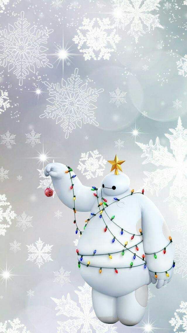 a white polar bear holding a christmas ornament in the air with snowflakes on it