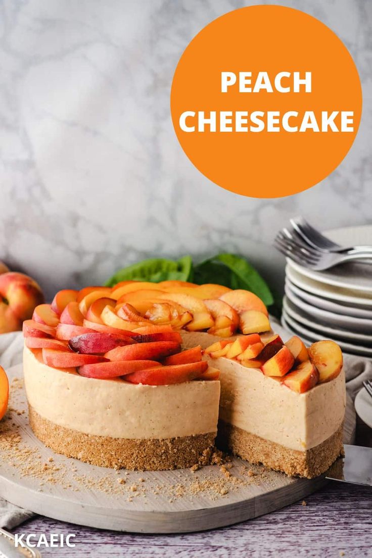 a cheesecake topped with sliced peaches on a plate