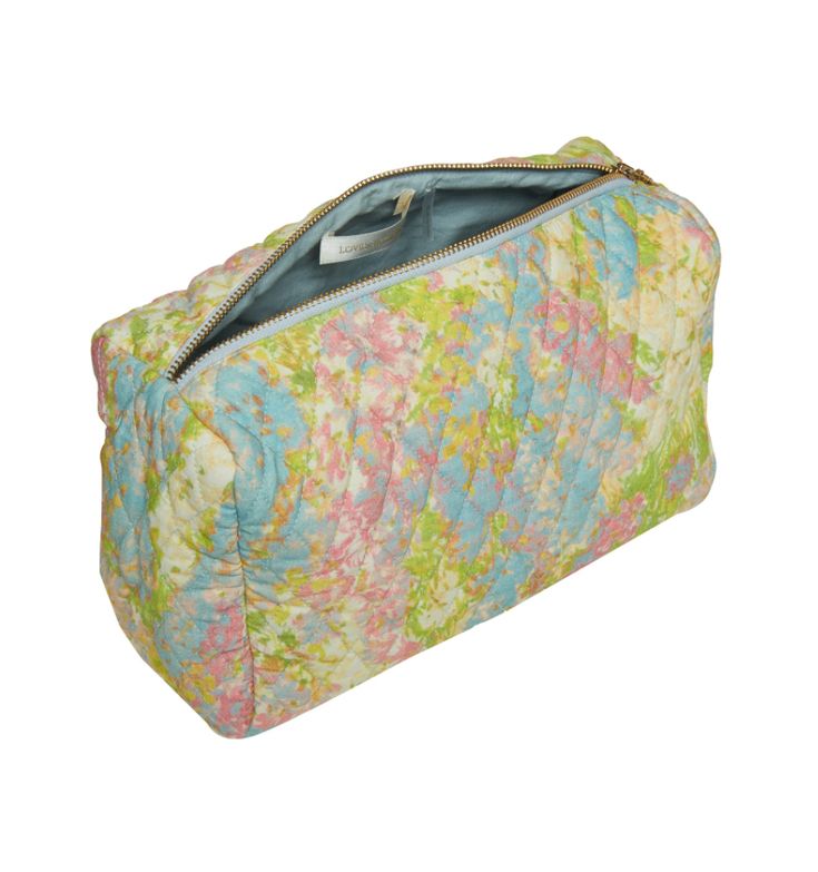 The Octavia Bag in this cute patchwork print is the perfect clutch or cosmetic purse. It's soft and compact with a zip closure at the top. Measurements: H: 10.75", W: 11", D: 4.9" Multicolor Travel Zipper Pouch, Multicolor Zipper Pouch For Travel, Spring Travel Quilted Bag, Multicolor Rectangular Cosmetic Bag For Travel, Multicolor Rectangular Travel Cosmetic Bag, Trendy Multicolor Cosmetic Bag With Zipper, Trendy Multicolor Cosmetic Bag With Zipper Closure, Multicolor Rectangular Cosmetic Bag With Zipper, Multicolor Pouch Cosmetic Bag