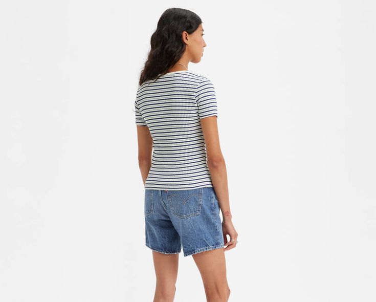 It may look like a T-shirt, but upon closer inspection, our Britt Snap-Front Top is anything but. With snap button closure and a slim fit through the body and sleeve, this supersoft top tucks into a pair of Levi's® denim with ease. Slim fit through the body and sleeves Features a snap button closure Fitted Casual T-shirt With Button Closure, Fitted Spring T-shirt With Button Closure, Levi's Tops With Button Closure For Summer, Levi's Tops With Button Closure For Spring, Levi's Cotton Tops With Button Closure, Fitted Levi's Cotton T-shirt, Fitted Levi's Cotton Top, Levi's Crew Neck Tops For Summer, Levi's Fitted Cotton T-shirt