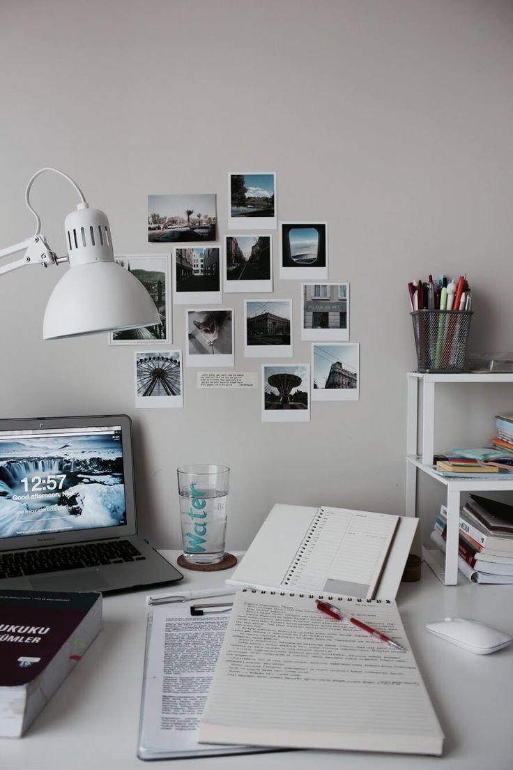 a laptop computer sitting on top of a white desk