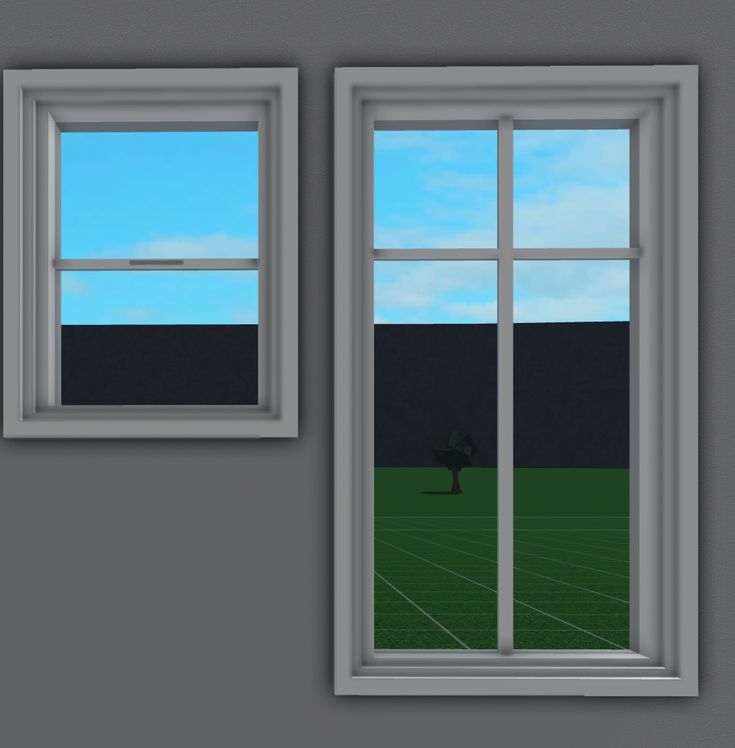 there are two windows in the wall and one has a small tree on the other side