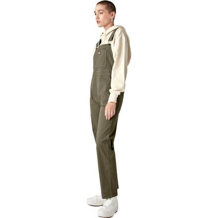 Yardwork just got way more fun with the Dickies Bib Overall. These women-specific overalls are built with cotton twill fabric, providing optimal stretch to keep us kneeling, squatting, and climbing with freedom, while utility pockets and a hammer loop store our tools with ease. Utility Cotton Overalls With Bib Front, Cotton Utility Overalls With Bib Front, Cotton Overalls With Pockets For Work, Utility Cotton Overalls For Workwear, Streetwear Cotton Overalls With Cargo Pockets, Utility Bib Front Bottoms For Fall, Utility Overalls With Side Pockets For Streetwear, Cotton Overalls With Cargo Pockets For Streetwear, Fall Cargo Style Overalls