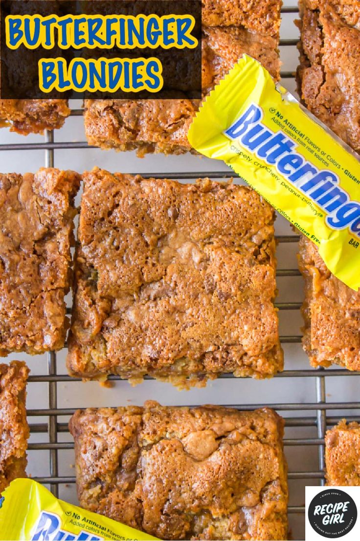 butterfingered blondies are lined up on a cooling rack with the wrapper