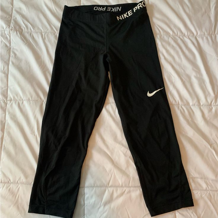 Calf Length Nike Pro Leggings, Never Worn. Nike Yoga Pants For Sports, Nike Go-dry Leggings For Sports, Nike Sportswear Tights For Training, Nike Training Tights Sportswear, Nike Black Yoga Pants, Nike Black Stretch Yoga Pants, Nike Moisture-wicking Sports Leggings, Nike Go-dry Workout Pants, Sporty Black Nike Yoga Pants