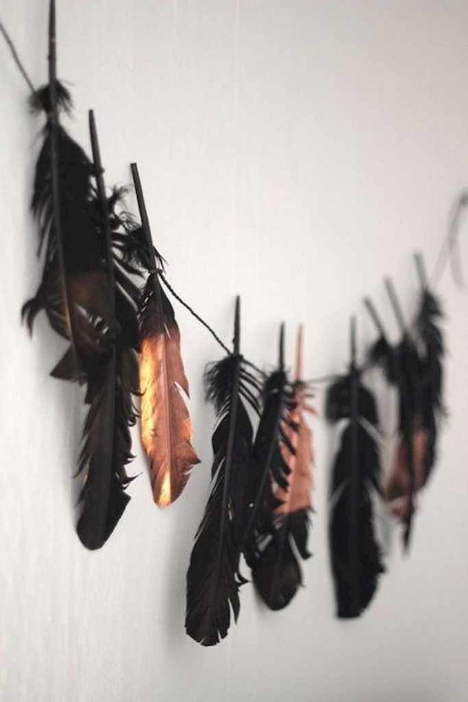 there are feathers hanging on the wall