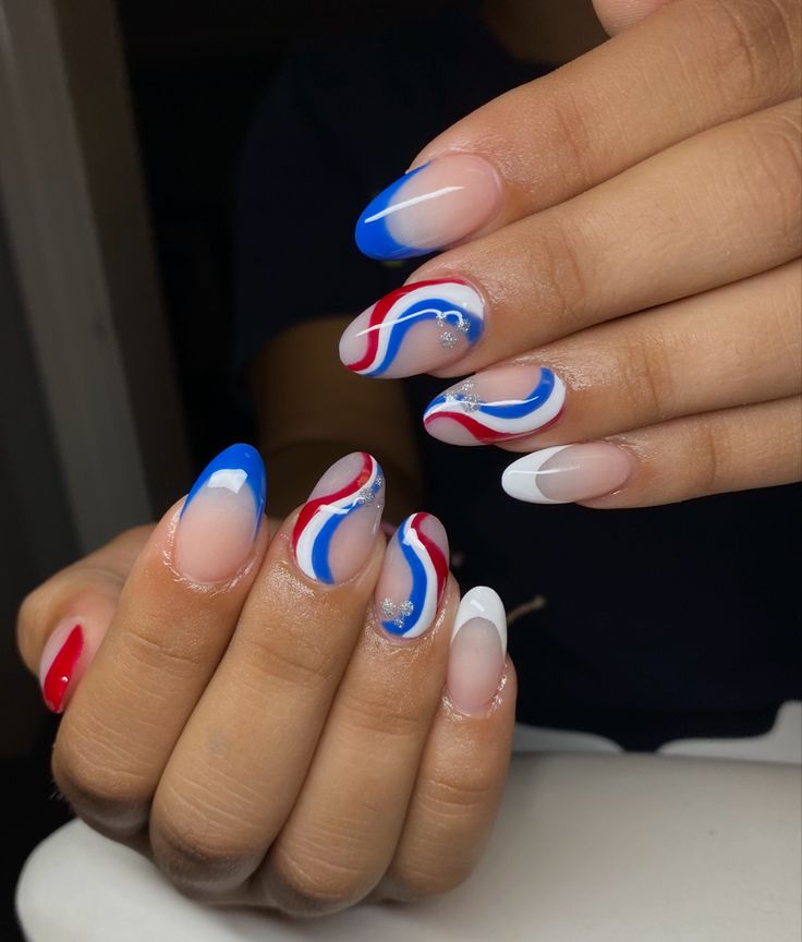 Fourth of July inspired nails. Almond Nails Fourth Of July, White Nails With Red And Blue, French Tip Nails With Design Fourth Of July, White Red And Blue Nails, Pretty Royal Blue Nails, Red White Blue Gel Nails, 4th Of July Swirl Nails, 4 Of July Nails Gel, Blue White And Red Nails