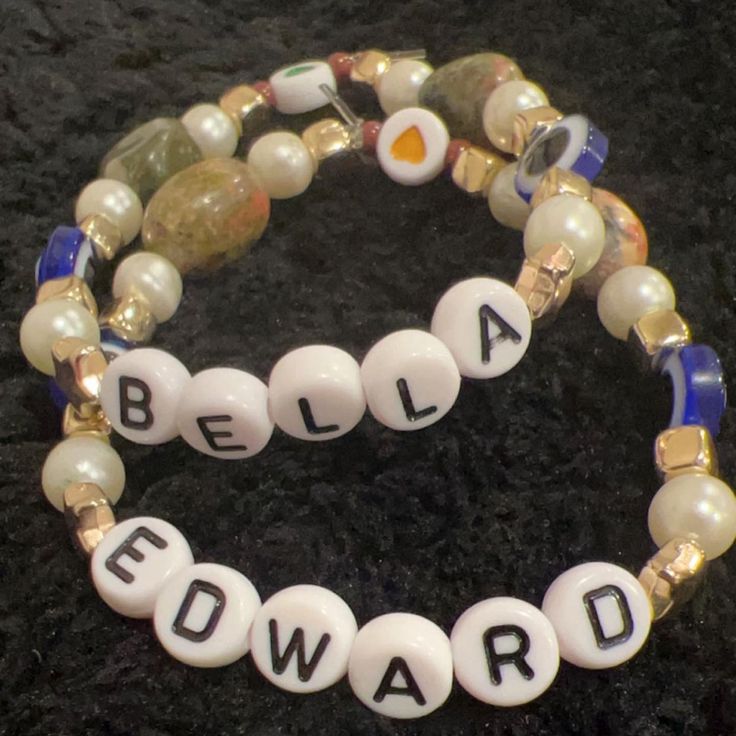 two beaded bracelets with beads that spell out the word beware on them