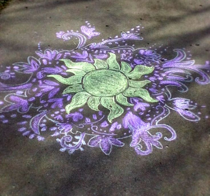 the sidewalk is painted with purple and green flowers