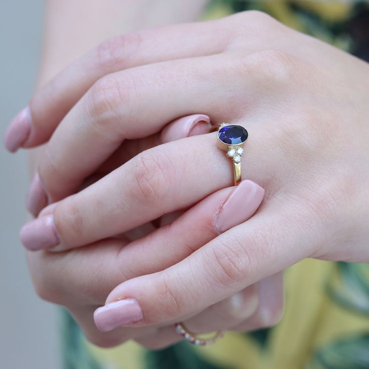 "Gorgeous vintage inspired Sapphire ring with Diamonds Bezel set with a deep blue Sapphire gemstone Handmade by an inspired jewelry artist team with decades of experience in the craft of jewelry making. Each gemstone, each diamond is carefully picked. Using only the finest raw materials and the highest industry standard in manufacturing, design and finish. A beautiful vintage inspired piece handmade just for you. Ring Features: - Gemstone info: 8x6 mm blue Sapphire, Grade AAA, Oval cut, 1.26ct - Ombre Rings, Diamond Ring Solitaire, Gold Ring Diamond, Ring Blue Sapphire, Oval Sapphire Ring, Jewelry Artist, Blue Sapphire Ring, Sapphire And Diamond Ring, Blue Stone Ring