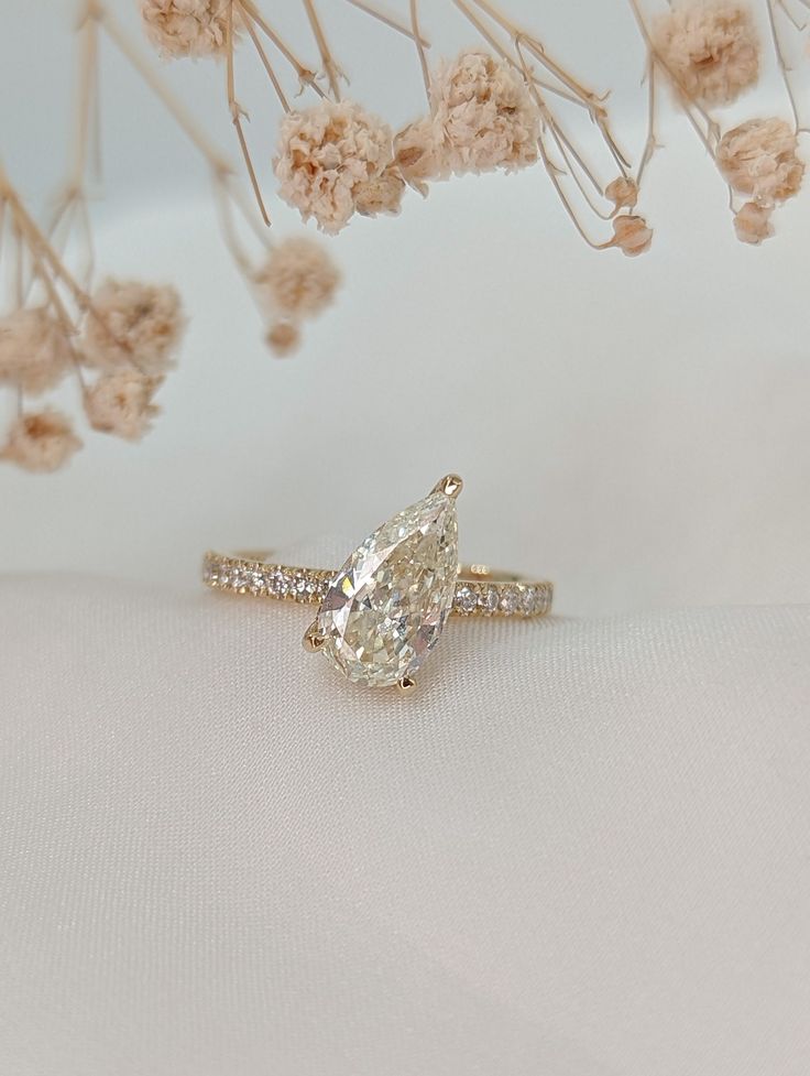 Total carat weight: 1.20 Carat Main stone weight: 1.00 Carat Shape: Pear Color: D Clarity: VS2 Type: Natural diamond Certificate: GIA (2264081651) Ring metal: 14K Yellow gold Custom made Each ring on our shop can be custom made according to your own personal preference. For example, we can create a ring made of 14K white gold rather than yellow gold, change the main stone for a bigger one, add side stones and so on... just name it and we will make it happen. We are here to fulfill your fantasy. Teardrop Yellow Gold Diamond Ring With Diamond Cut, 14k Gold Teardrop Brilliant Cut Rings, 14k Gold Pear-shaped Diamond White Ring, 14k Gold Teardrop Ring With Brilliant Cut, 14k Gold Teardrop Diamond Ring For Anniversary, Yellow Gold Teardrop Brilliant Cut Diamond Ring, Gold Teardrop Diamond Ring With Vvs Clarity, Pear Shaped Diamond Ring With Diamond Cut, Gold Teardrop Diamond Ring For Proposal