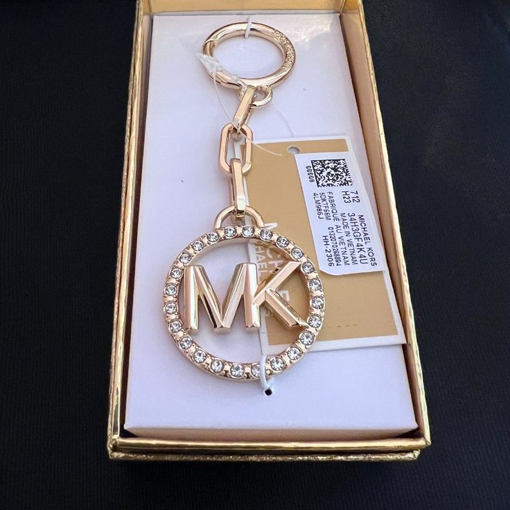 Add Some Mk Love To Any Accessory With This Key Charm By Michael Michael Kors. 18kt Plated Gold Or Rhodium Plated Silver Over Zinc 1"W X 4-1/2"H Item Comes Packaged In A Gift Box 1-Year Manufacturer's Limited Warranty Zinc Spot Clean Imported Luxury Jewelry With Metal Logo, Luxury Jewelry With Metal Logo For Gift, Luxury Jewelry Gift With Metal Logo, Silver Jewelry With Gold-tone Logo Plaque As Gift, Gold Jewelry With Metal Logo For Gifts, Gold Jewelry With Metal Logo As A Gift, Michael Kors Logo, Gold Bag, Rhodium Plated