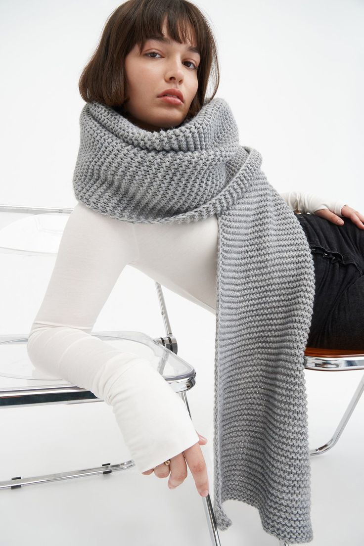 Make your style A LOT cozier with our extra-long Bronx Scarf. Bronx is both knit from ultra-soft French Merino Wool mix to warm your soul and fashioned extra long to make a statement. Wrap this Merino wool scarf around and around for volume, or wear her draped over your shoulders to lend your look texture and drama. This soft wool scarf also doubles perfectly as an airplane blanket. | Natalee, in medium grey, is 5'10" (178 cm) tall. Astrid, in medium grey, is 5'9" (175 cm) tall. Steph Long Knit Scarf, Burnt Yellow, Airplane Blanket, Money Stacks, Merino Wool Scarf, Chunky Scarves, Crochet Wool, Retro Clothing, The A Team