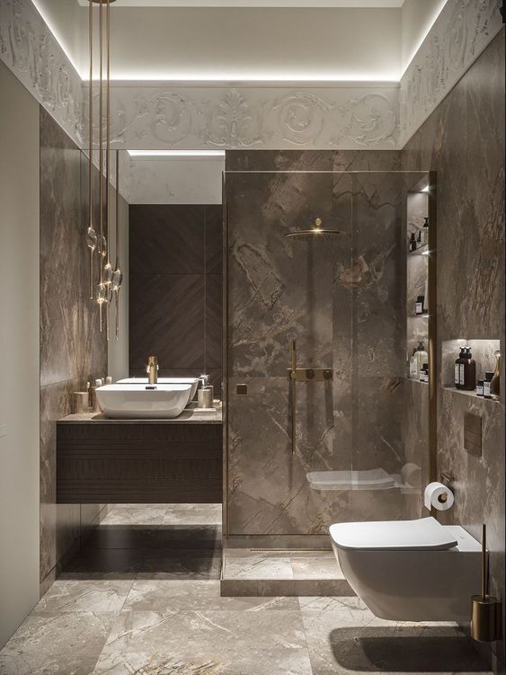 an elegant bathroom with marble walls and flooring, including a bathtub in the center