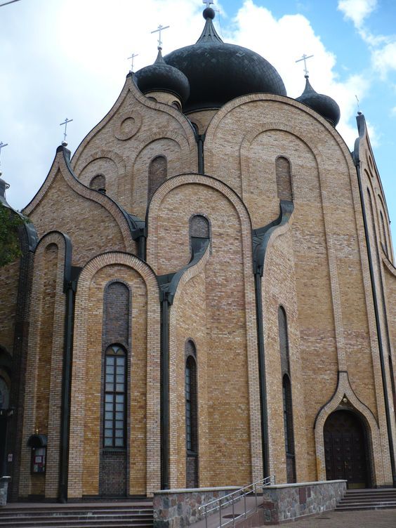 an old church with steeples and crosses on the roof