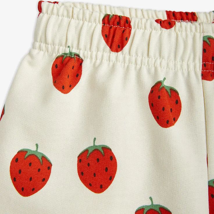 Upcycled Strawberries Sweatshorts Offwhite | Mini Rodini Organic Cotton Shorts With Elastic Waistband For Summer, Playful White Cotton Pajama Shorts, Spring Cotton Bottoms With Strawberry Print, Spring Organic Cotton Shorts With Elastic Waistband, Cute Cotton Pajama Shorts With Elastic Waistband, Cute White Shorts With Elastic Waistband, Playful White Cotton Shorts, Casual Cotton Bottoms With Strawberry Print, White Organic Cotton Bottoms With Elastic Waistband