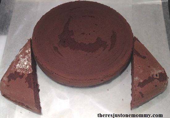 a chocolate cake sitting on top of a piece of wax paper