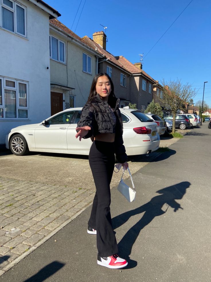 flares,puffer jacket,white shoulder bag and jordans Flare Pants Hoodie Outfit, Hoodie With Flared Pants, Flare Leggings And Hoodie Outfit, Flare Leggings And Puffer Jacket, Hoodie And Flare Leggings, Crop Jean Jacket, Jordan 4s, White Shoulder Bag, Jean Jacket Outfits