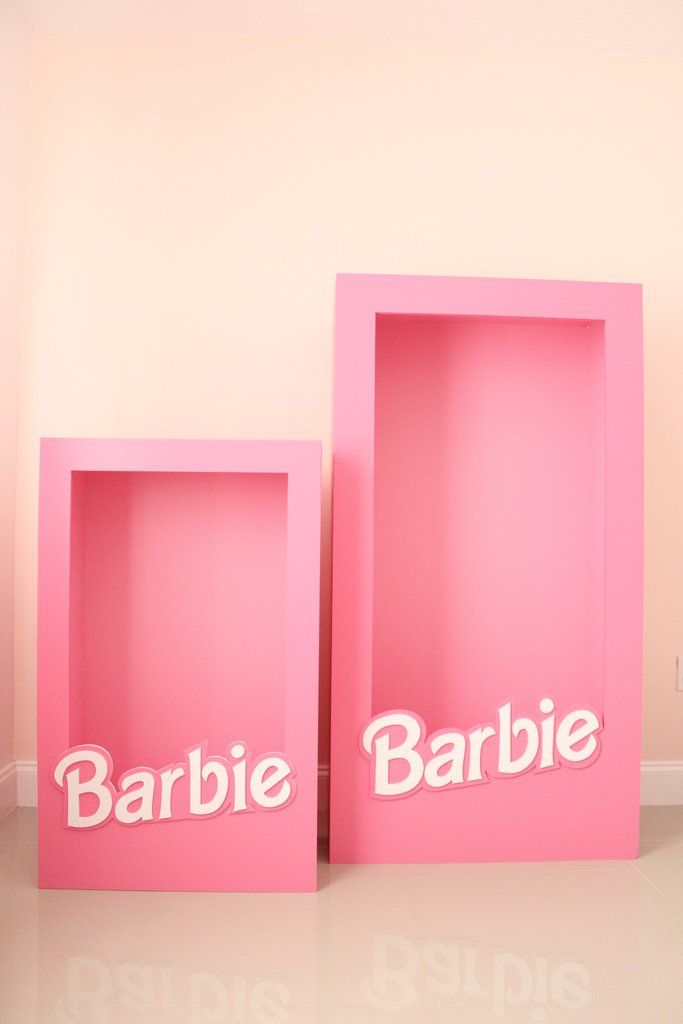 two pink boxes with the word barbie on them