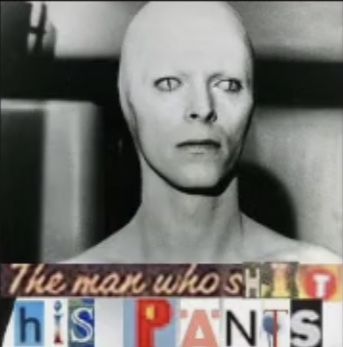 the man who shot his pants is standing in front of a television screen with words on it