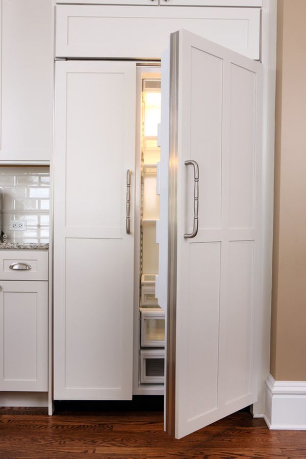 a white refrigerator freezer sitting inside of a kitchen