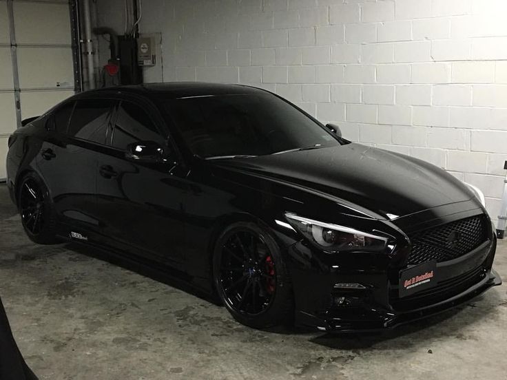 a black sports car parked in a garage