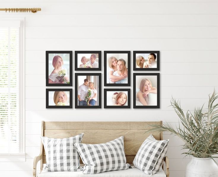 a bench with pillows and pictures hanging on the wall