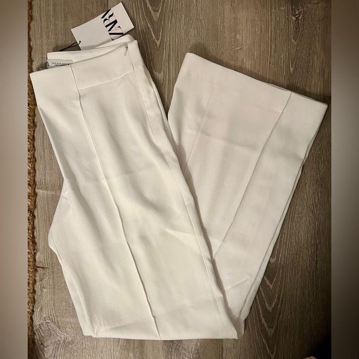 Fluid High Waist Pants With Straight Legs. Side Hidden In-Seam Zip Closure. Measurements Size - Medium Waist - 15” Rise - 11” Length - 32” Color - White Size - Medium Condition - Nwt White Wide Leg Pants For Spring Office Wear, Spring White Wide Leg Office Pants, Chic White Wide Leg Pants For Office, White Wide-leg Dress Pants For Office, Chic White Wide-leg Dress Pants, White Wide Leg Office Dress Pants, Fitted White Wide Leg Pants For Office, White Fitted Wide Leg Pants For Office, White Wide Leg Dress Pants For Office