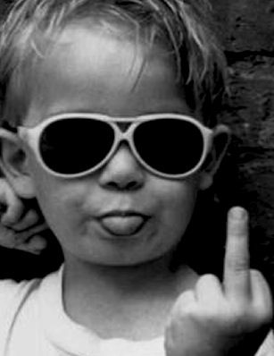 a young boy wearing sunglasses making the peace sign with his fingers and saying, i'm still me