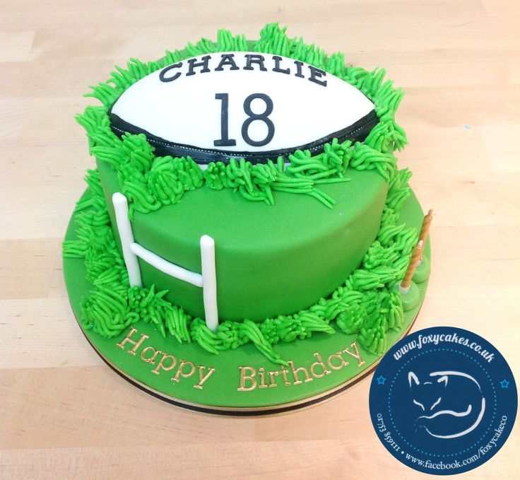 a birthday cake for a football player with green frosting and grass on the top