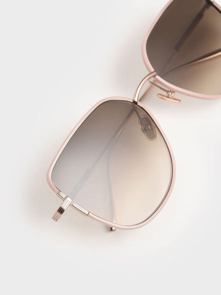 Keep cool while taking utmost care of your eyes with these butterfly sunglasses. Featuring tinted lenses that will shield you from the glare of the sun, these gems come in a cut-out frame design that injects maximum style with minimal fuss. Made in feminine pink hue, team them with a floral dress and a denim jacket for a casual look. Top it all off with some strappy sandals. Brand Collaboration, Butterfly Sunglasses, Black Panels, Charles Keith, Keep Cool, Sunglasses & Glasses, Strappy Sandals, Frame Design, Your Eyes