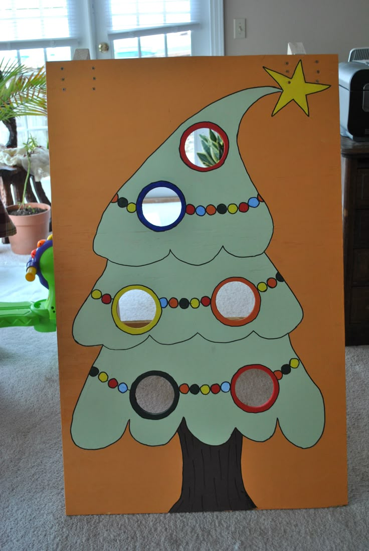 a cardboard christmas tree with circles on it