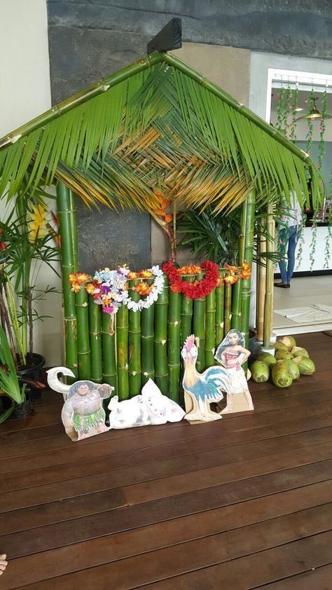 a house made out of bamboo sticks and flowers