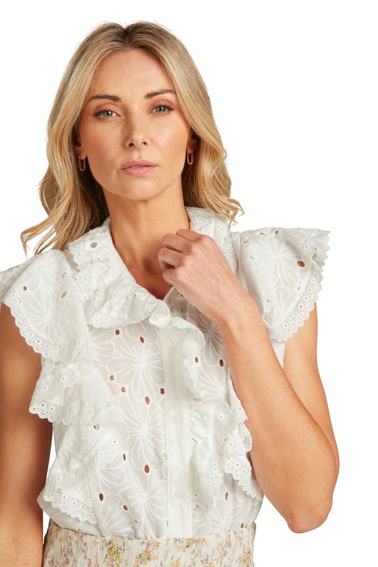 Stunning both coming and going, you are going to love this stunning white eyelet blouse. Delicate, feminine ruffles with just the right amount of volume grace this front and sleeves of this blouse. The ruffles & collar are finished off with an eyelet lace trim. Button front. 100% cotton, machine wash, hang dry. Model is 5'9" and wearing a size 2. If between two sizes, we'd recommend sizing down! Spring Tops With Broderie Anglaise And Ruffled Collar, Chic Fitted Eyelet Blouse, Chic Blouse With Broderie Anglaise And Ruffled Collar, Feminine Fitted Eyelet Blouse, Feminine Fitted Blouse With Eyelet Details, Chic Tops With Broderie Anglaise And Ruffled Collar, Feminine Tops With Broderie Anglaise And Ruffled Collar, Fitted Blouse With Broderie Anglaise And Ruffled Collar, Chic Lace Eyelet Tops